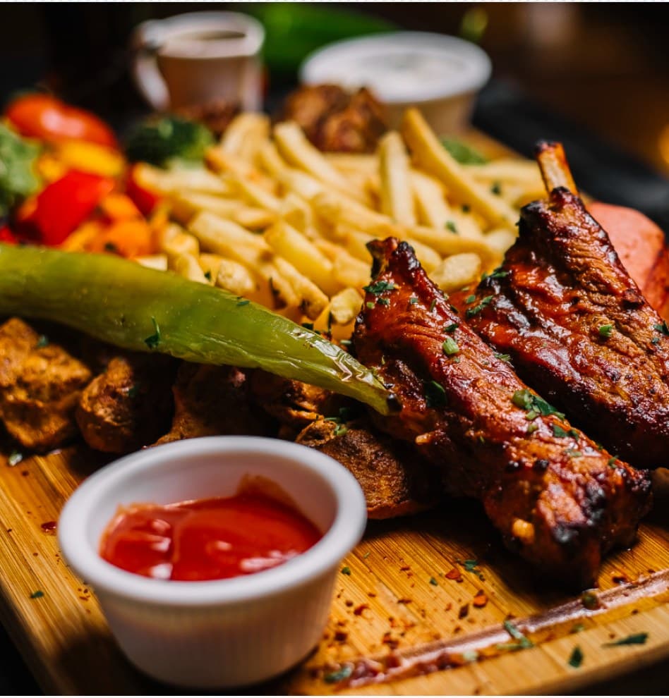 Grilled dish with fries and sauce